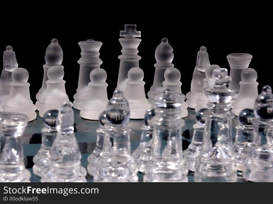 Chess Game - Chess Pieces on a glass chessboard