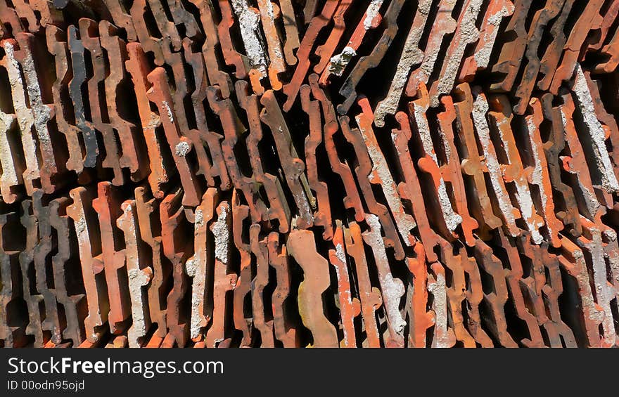 A big pile of roof tiles on a facade. A big pile of roof tiles on a facade