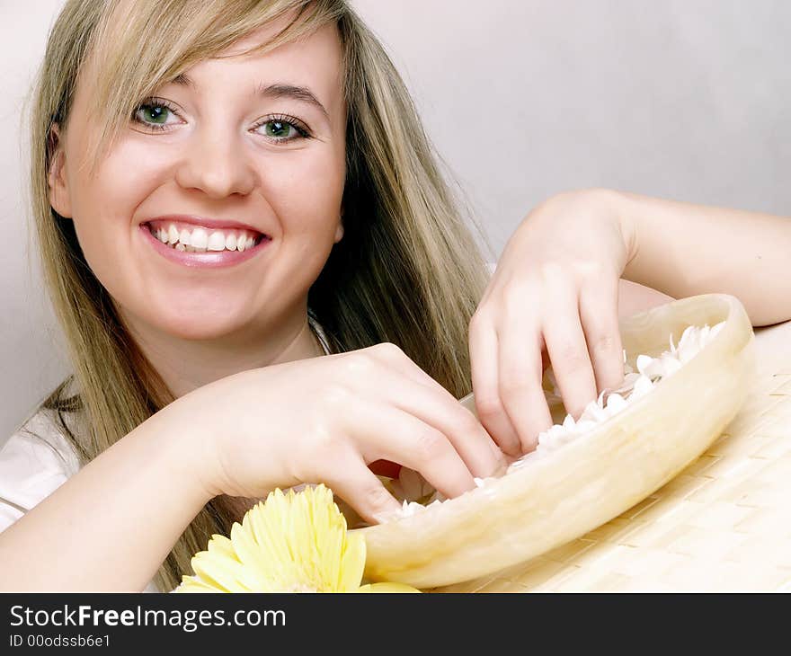 Beautiful woman and bowl full of flower. Beautiful woman and bowl full of flower