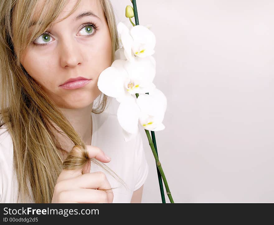 Close up of beautiful woman with white orchid. Close up of beautiful woman with white orchid