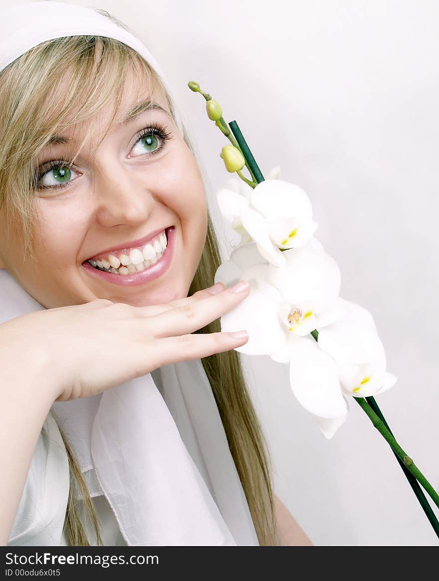 Close up of beautiful woman with white orchid. Close up of beautiful woman with white orchid