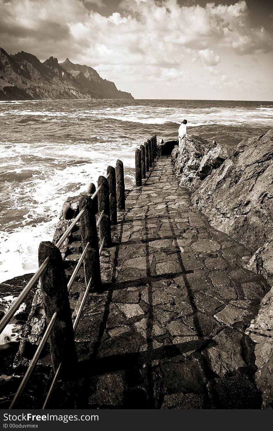 Girl at the end of a footpath, between earth, sea and air. Girl at the end of a footpath, between earth, sea and air.