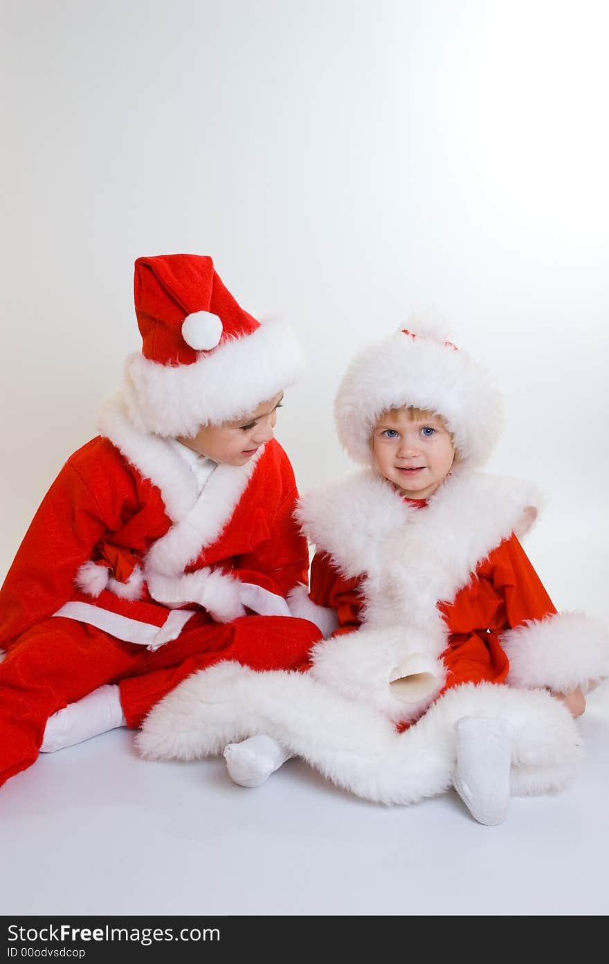 Two baby Santa portrait isolated. Two baby Santa portrait isolated