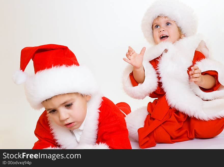 Two baby Santa portrait isolated. Two baby Santa portrait isolated