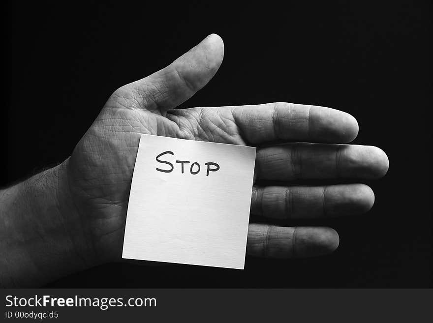 A Hand with Stop printed on a card. A Hand with Stop printed on a card.