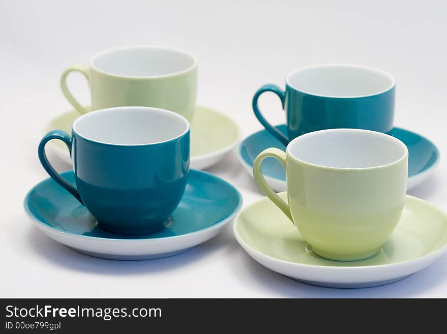 Blue and green coffee cups with matching saucer