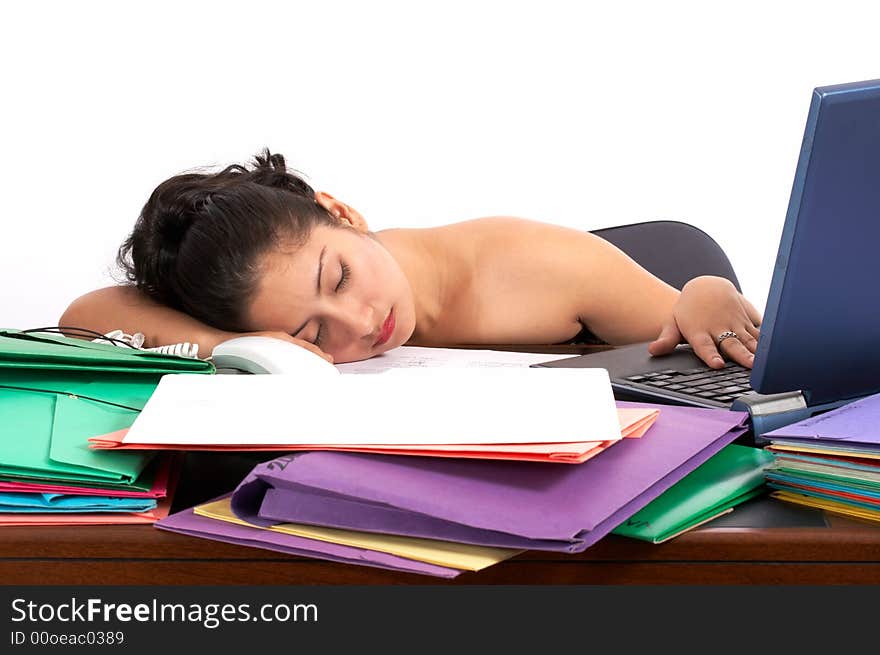 A businesswoman sleeping on her office desk