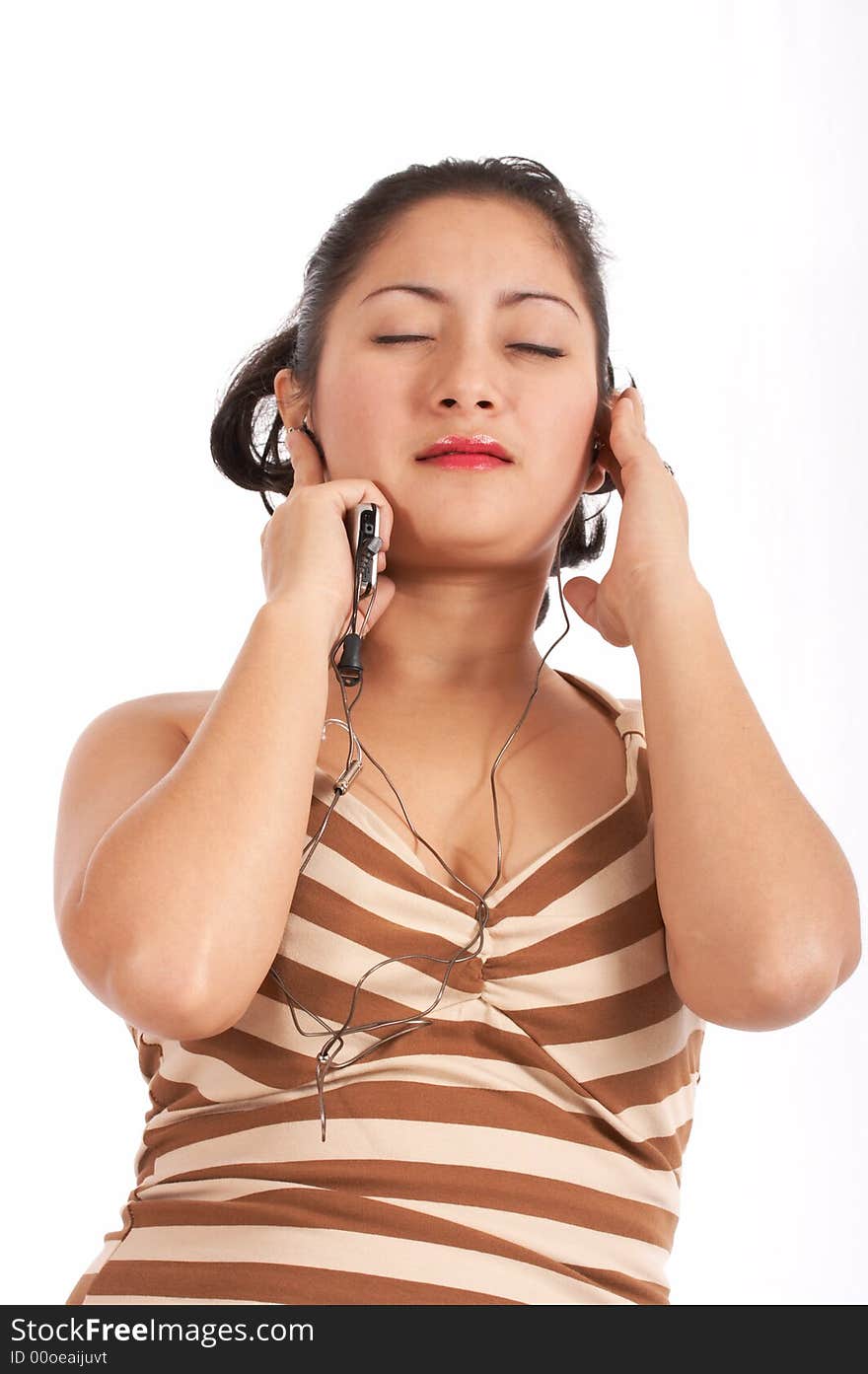 A pretty young lady listening to music