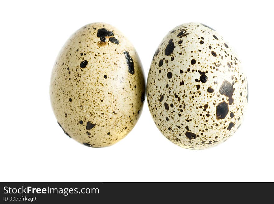 Two quail eggs isolated on white