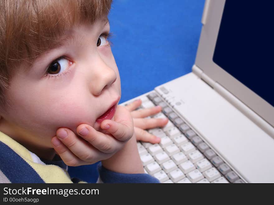 Young boy using a laptop