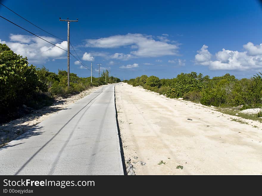 The half paved road on Anegada Island in the British Virgin Islands BVI. The half paved road on Anegada Island in the British Virgin Islands BVI