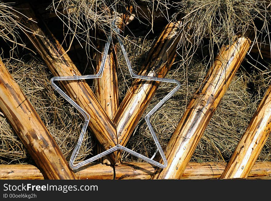 A Christmas star over a stable roof