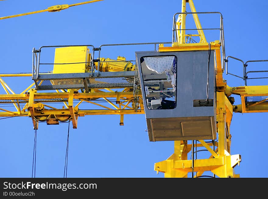 Crane cabin detail over a clean blue sky