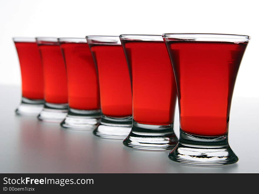 Wineglass with a wine photographed on a white background. Wineglass with a wine photographed on a white background