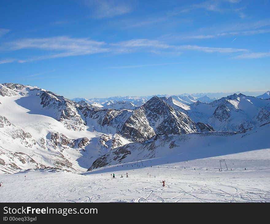 Sun over snowy mountain scene. Sun over snowy mountain scene