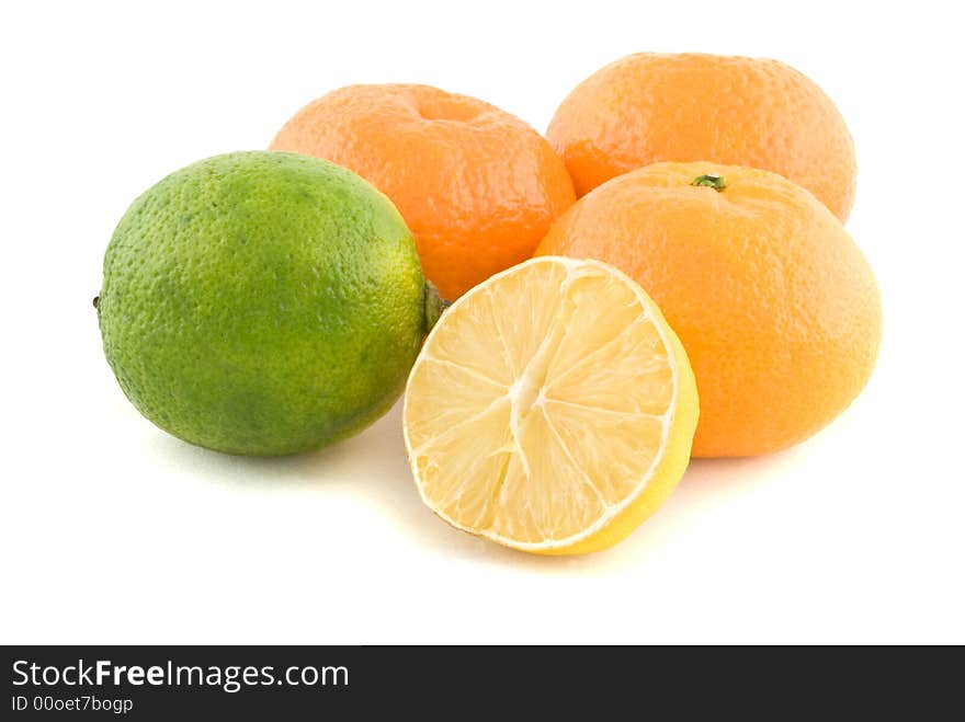 Oranges, lime and a lemon isolated on white. Oranges, lime and a lemon isolated on white.