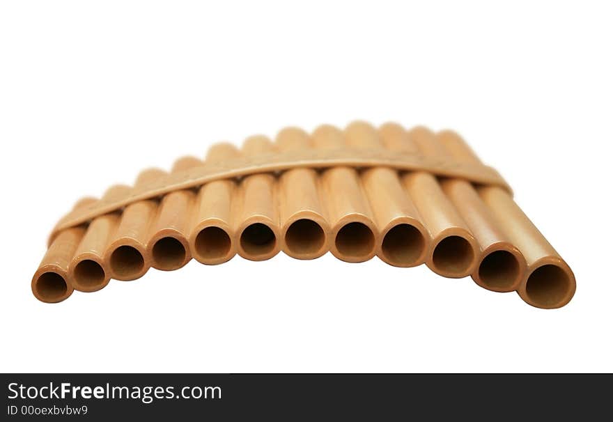 Wooden pan flute on a white background. It is isolated