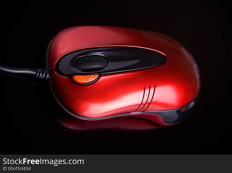 Computer mouse on reflective background close up