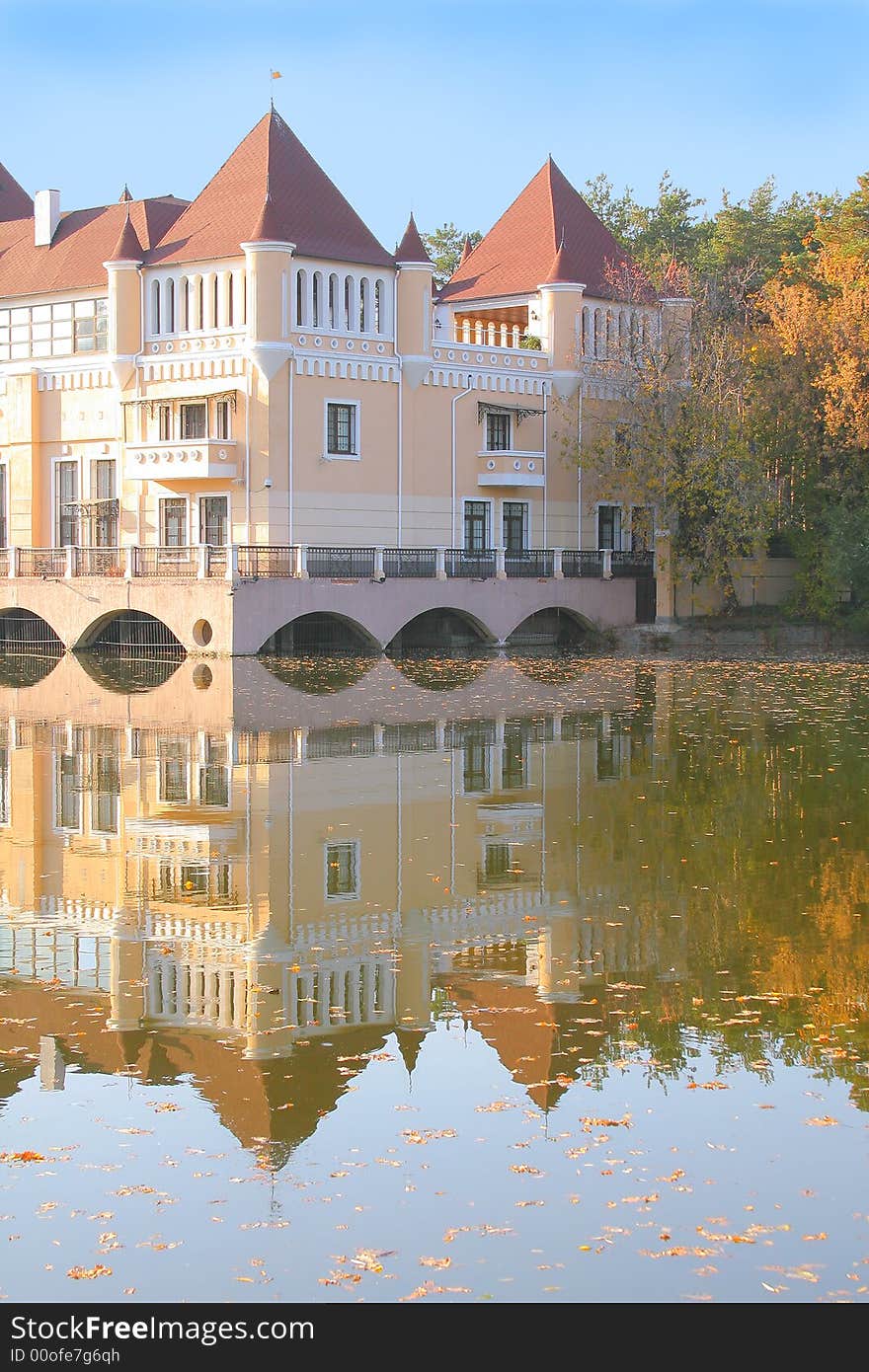 Castle on the lake coast in autumn. Castle on the lake coast in autumn