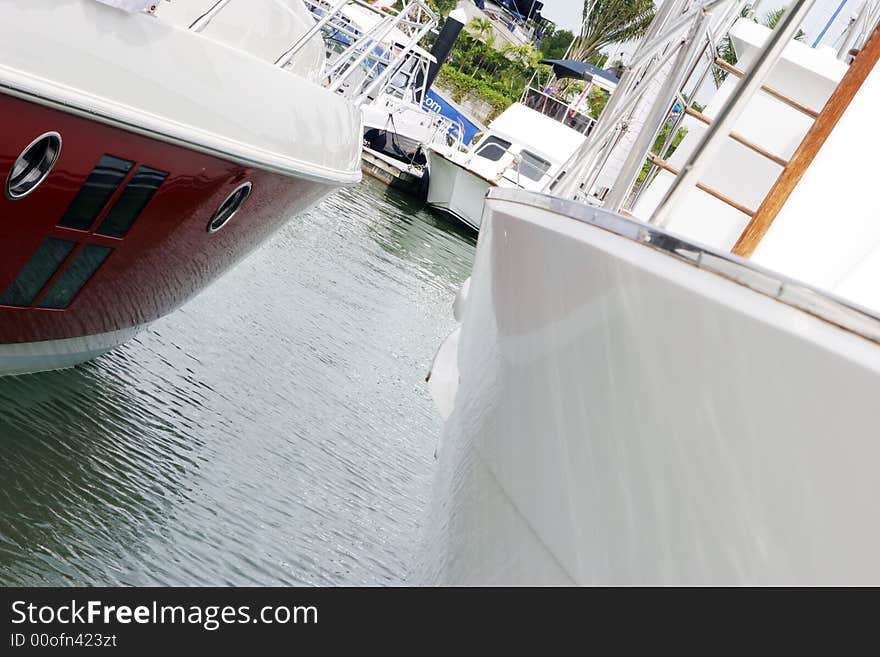 Close-up of luxury sailing boats moored at a marina.