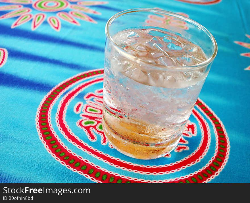 Glass of iced water on a table.