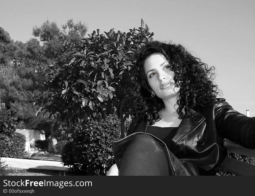 A brunette young beautiful woman with green eyes monochromatic. A brunette young beautiful woman with green eyes monochromatic