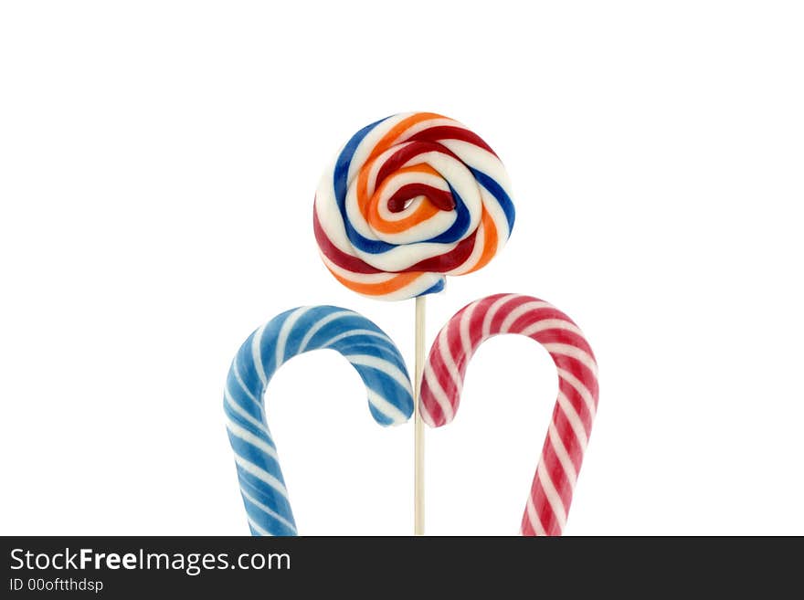 Candy cane and colorful suckers isolated on white background