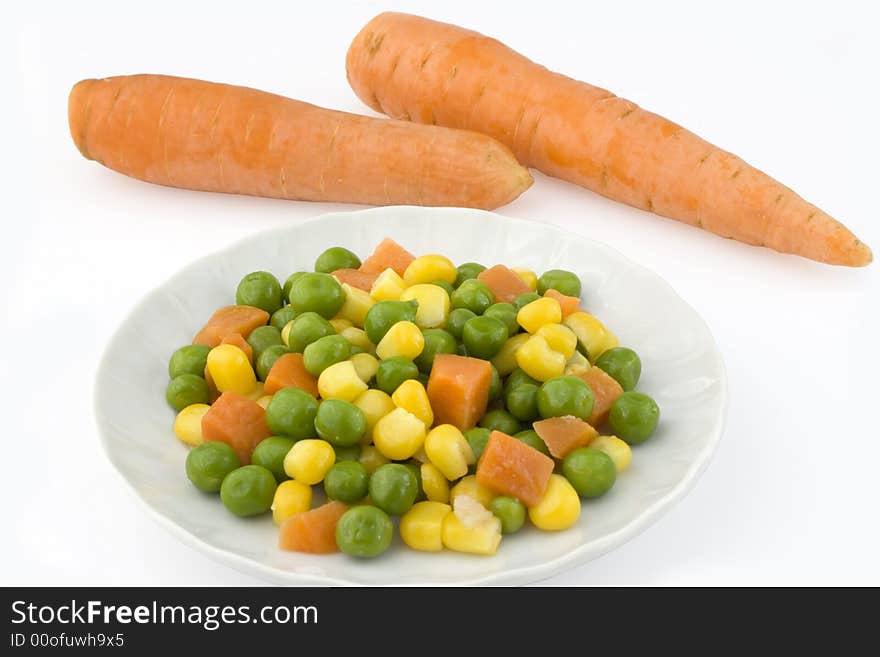 Vegetables and two carrots isolated on white background