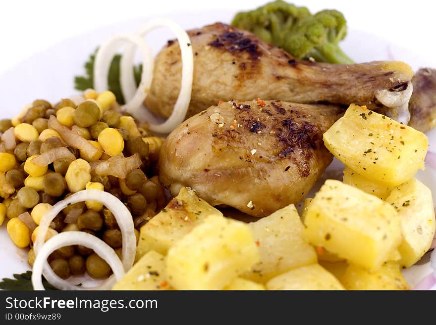 Roasted chicken with roasted potatoes and garden vegetables