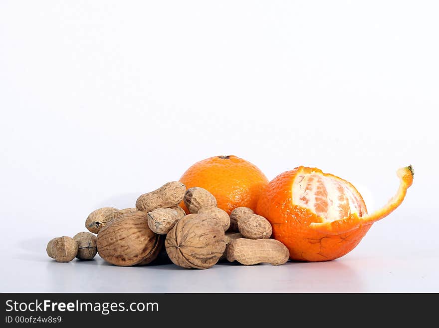 A variety of fruits with diferent nuts. Isolated over white space (for text). A variety of fruits with diferent nuts. Isolated over white space (for text).