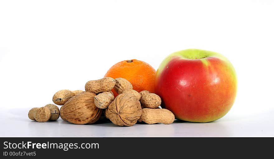 A variety of fruits with diferent nuts. Isolated over white space (for text). A variety of fruits with diferent nuts. Isolated over white space (for text).