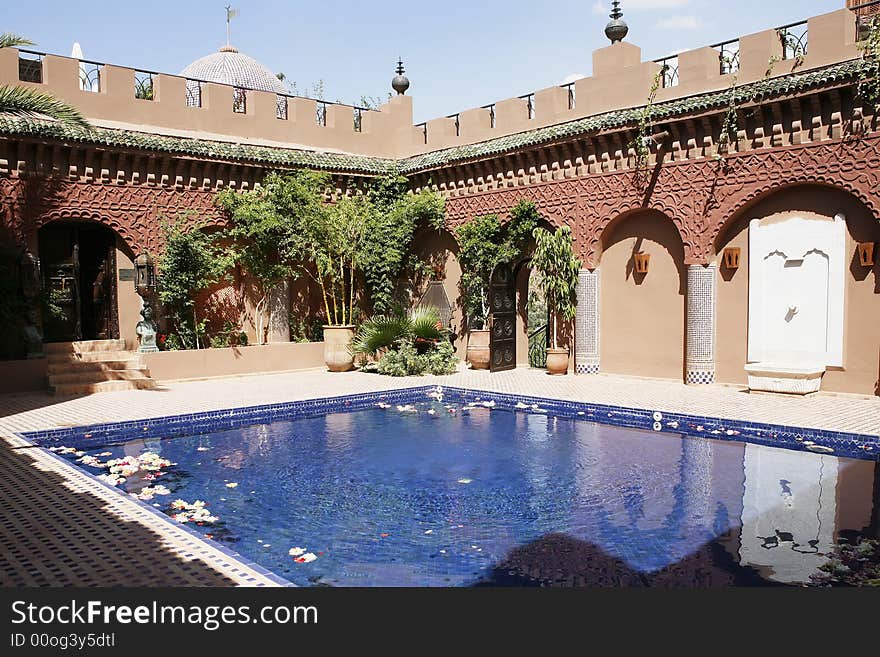 A beautiful luxury pool on a sunny day. A beautiful luxury pool on a sunny day