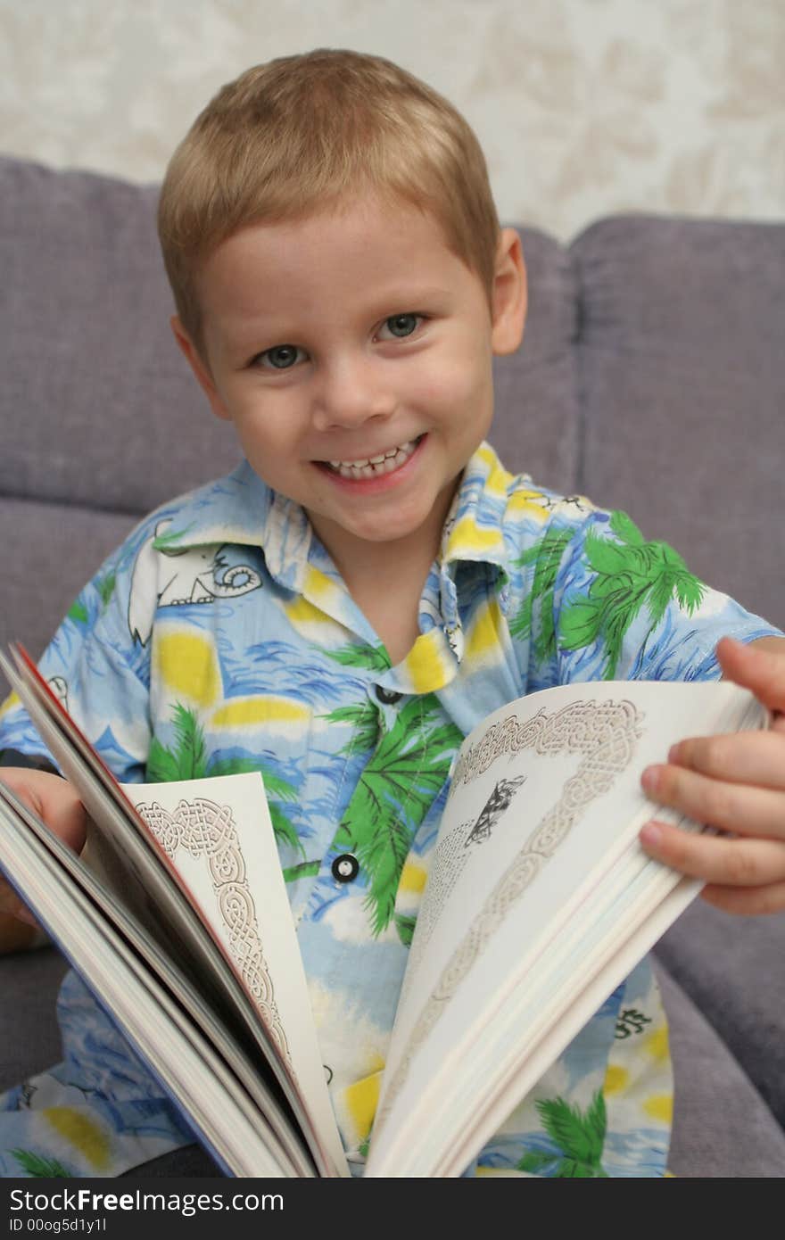 The Happy Boy Holds The Greater Book In Hands