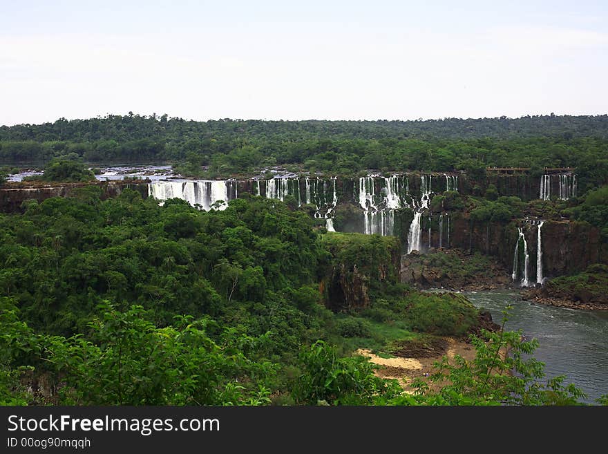 The Iguassu (or Iguazu) Falls is one of the largest masses of fresh water on the planet and divides, in South America, Brazil, Paraguay and Argentina. The waterfall system consists of 275 falls along 2.7 kilometres (1.67 miles) of the Iguazu River. Some of the individual falls are up to 82 metres (269 feet) in height, though the majority are about 64 metres (210 feet). The Iguassu (or Iguazu) Falls is one of the largest masses of fresh water on the planet and divides, in South America, Brazil, Paraguay and Argentina. The waterfall system consists of 275 falls along 2.7 kilometres (1.67 miles) of the Iguazu River. Some of the individual falls are up to 82 metres (269 feet) in height, though the majority are about 64 metres (210 feet).