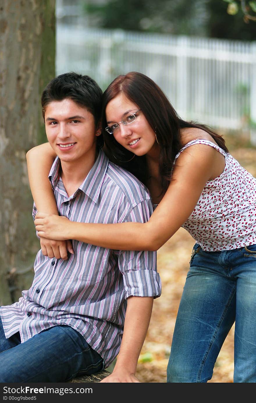 Girl is hugging her boyfriend. Girl is hugging her boyfriend