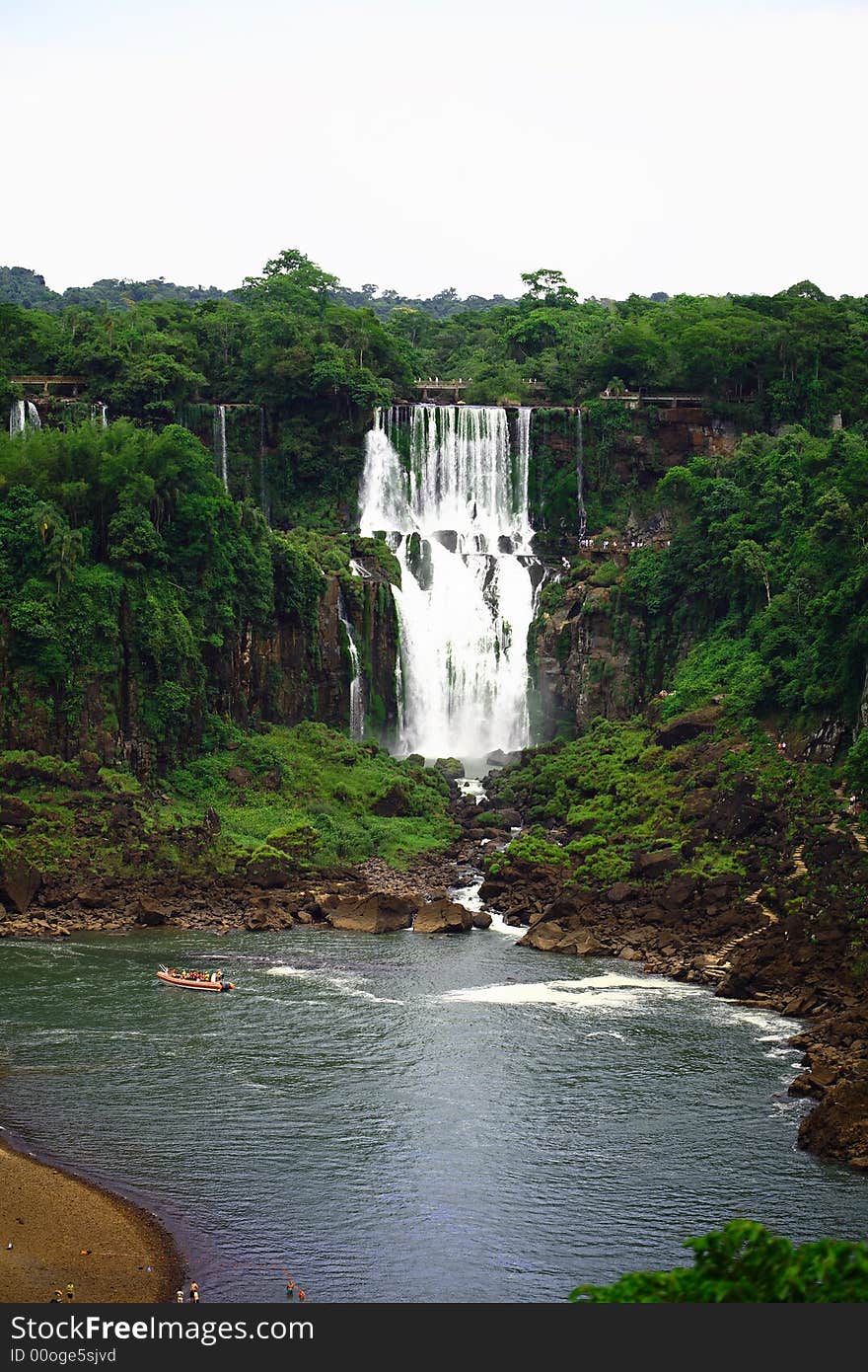 The Iguassu (or Iguazu) Falls is one of the largest masses of fresh water on the planet and divides, in South America, Brazil, Paraguay and Argentina. The waterfall system consists of 275 falls along 2.7 kilometres (1.67 miles) of the Iguazu River. Some of the individual falls are up to 82 metres (269 feet) in height, though the majority are about 64 metres (210 feet). The Iguassu (or Iguazu) Falls is one of the largest masses of fresh water on the planet and divides, in South America, Brazil, Paraguay and Argentina. The waterfall system consists of 275 falls along 2.7 kilometres (1.67 miles) of the Iguazu River. Some of the individual falls are up to 82 metres (269 feet) in height, though the majority are about 64 metres (210 feet).