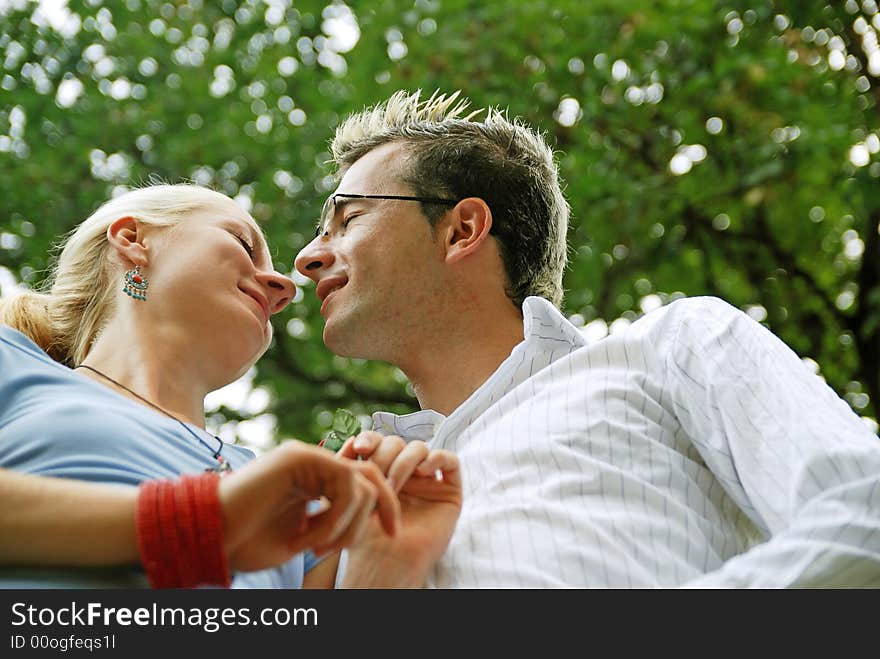 Young couple kissing in the park