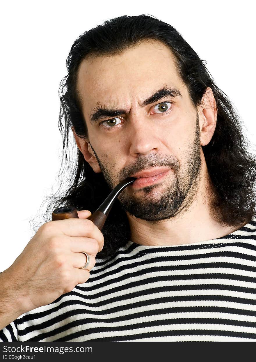 Aggressive unshaven man with pipe in sailor clothes