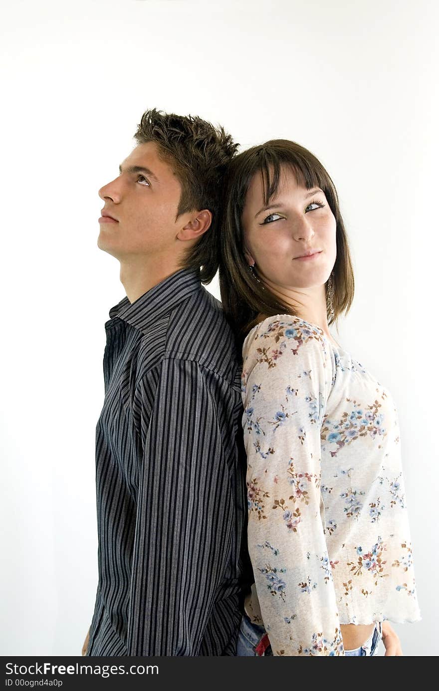 Girl and a guy posing in studio. Girl and a guy posing in studio