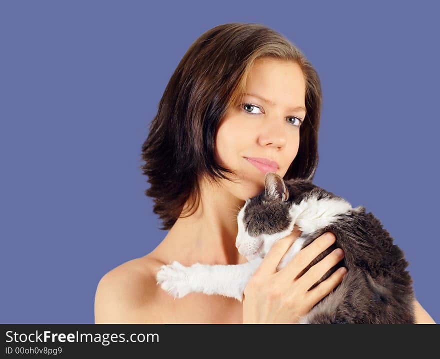 Young woman and old cat  on blue background. Young woman and old cat  on blue background