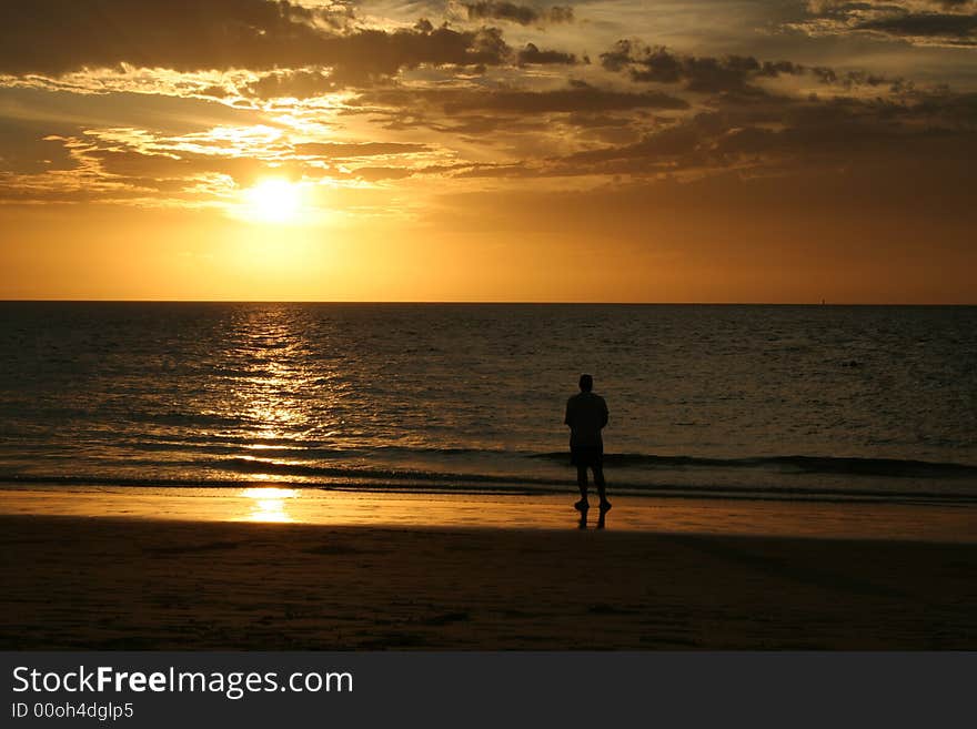 A man on Moreton Island at sunset