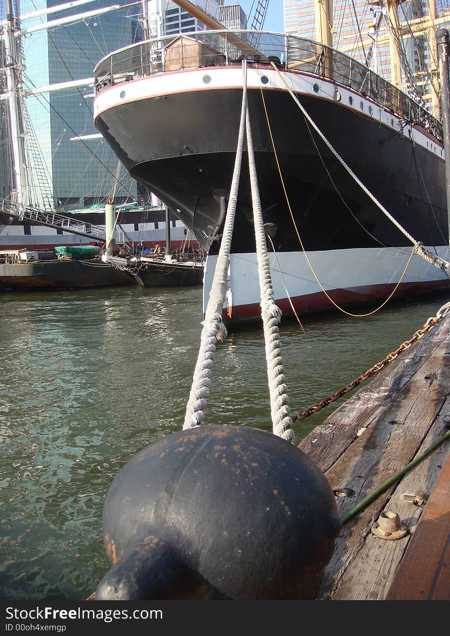 A large sailing ship docked at the South Street Seaport