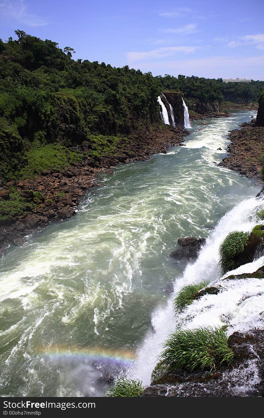 The Iguassu (or Iguazu) Falls is one of the largest masses of fresh water on the planet and divides, in South America, Brazil, Paraguay and Argentina. The waterfall system consists of 275 falls along 2.7 kilometres (1.67 miles) of the Iguazu River. Some of the individual falls are up to 82 metres (269 feet) in height, though the majority are about 64 metres (210 feet). The Iguassu (or Iguazu) Falls is one of the largest masses of fresh water on the planet and divides, in South America, Brazil, Paraguay and Argentina. The waterfall system consists of 275 falls along 2.7 kilometres (1.67 miles) of the Iguazu River. Some of the individual falls are up to 82 metres (269 feet) in height, though the majority are about 64 metres (210 feet).