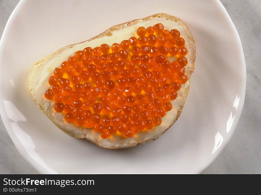 Red caviar on a white background