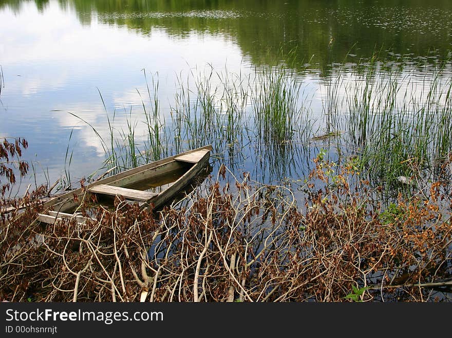 Old boat on a pond. Old boat on a pond