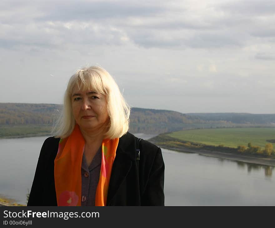 Portrait of the woman on a background of a river valley. Tom river, Tomsk, Siberia, Russia.