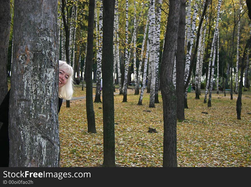 The woman in park in the autumn