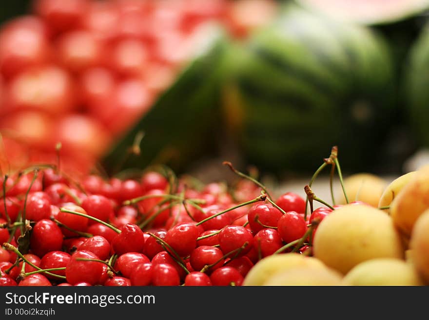 Red cherry and yellow pears, watermelons. Red cherry and yellow pears, watermelons