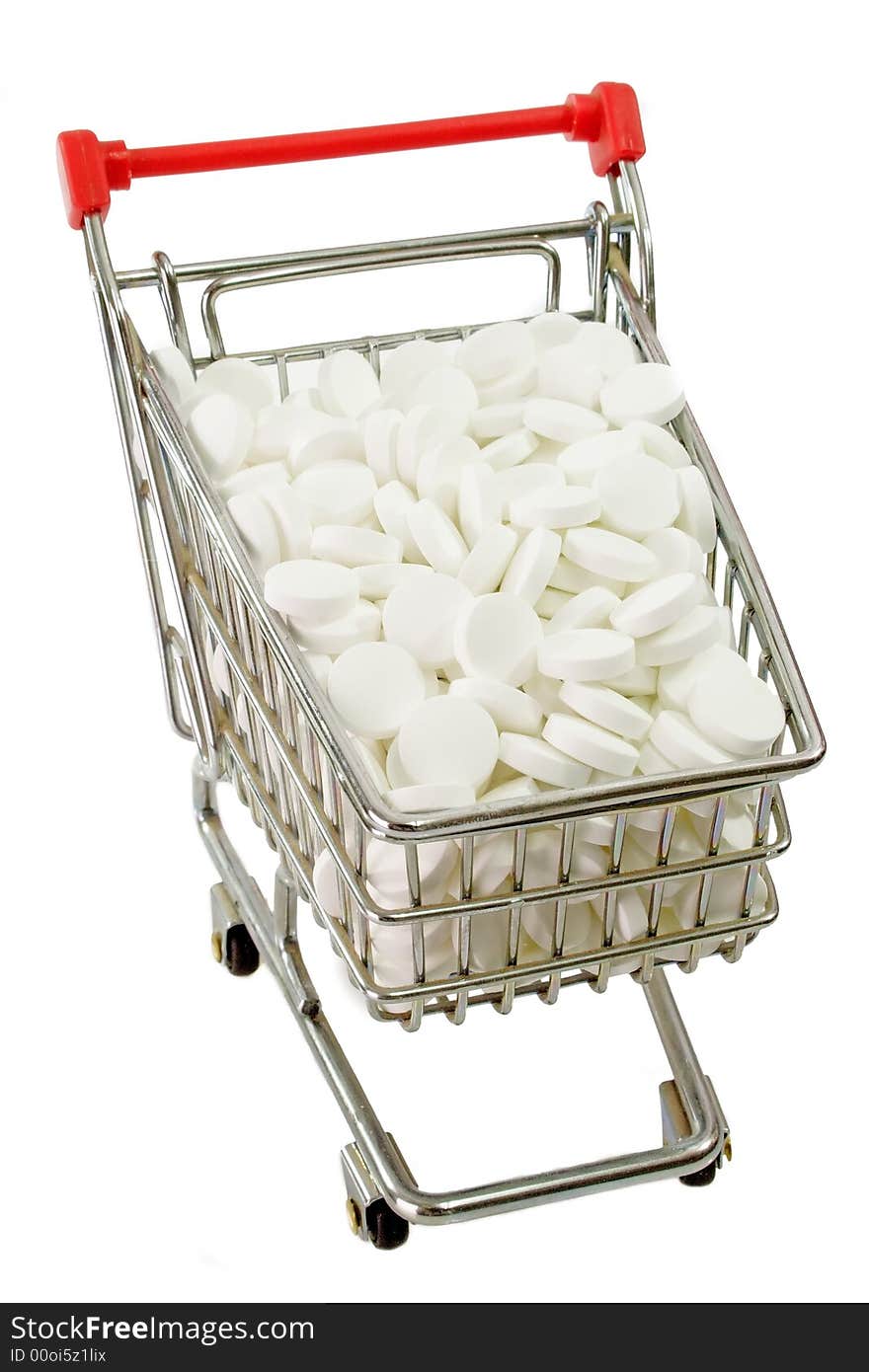 White pills in a trolley isolated on white background. White pills in a trolley isolated on white background