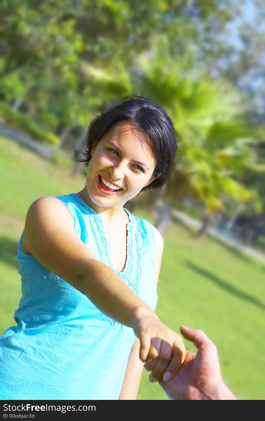 A portrait of attractive couple in summer environment. A portrait of attractive couple in summer environment.